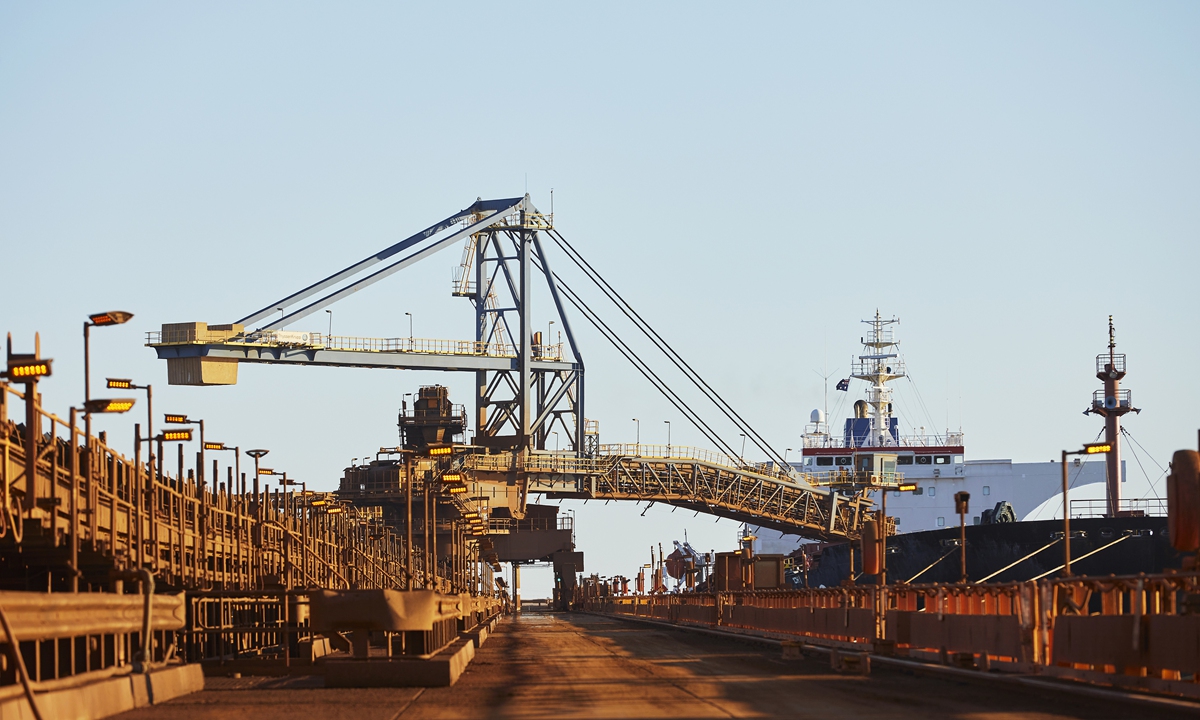 A bulk carrier operated by Fortescue Group loads iron ore bound for China at Port Hedland in Western Australia. Photo: Courtesy of FMG