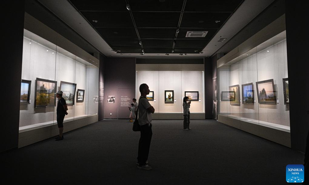 People visit an exhibition featuring classic works of 10 contemporary Russian art masters at Hainan Museum in Haikou, south China's Hainan Province, Aug. 13, 2025. The exhibition is held here from July 18 to Oct. 8, exhibiting five sculptures and 30 paintings from 10 famous Russian art masters. (Xinhua/Pu Xiaoxu)