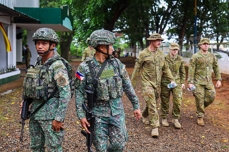 Filipino and Australian military soldiers are seen during the opening ceremony marking the start of the military exercise Alon 25, at a military base in Palawan, Philippines, on August 15, 2025.
