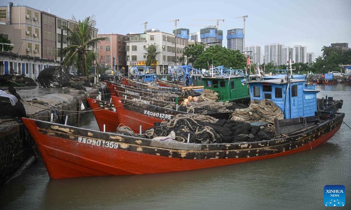 This photo taken on Aug. 16, 2025 shows fishing vessels temporarily delayed from setting sail due to tropical depression at a port in Haikou, south China's Hainan Province. The three-and-a-half-month summer fishing moratorium in the South China Sea concluded at noon on Saturday. To ensure safety amid an ongoing tropical depression, the Hainan Provincial Department of Agriculture and Rural Affairs issued a notice urging fishermen to temporarily suspend fishing activities and to keep their vessels safely sheltered in port. (Xinhua/Pu Xiaoxu)