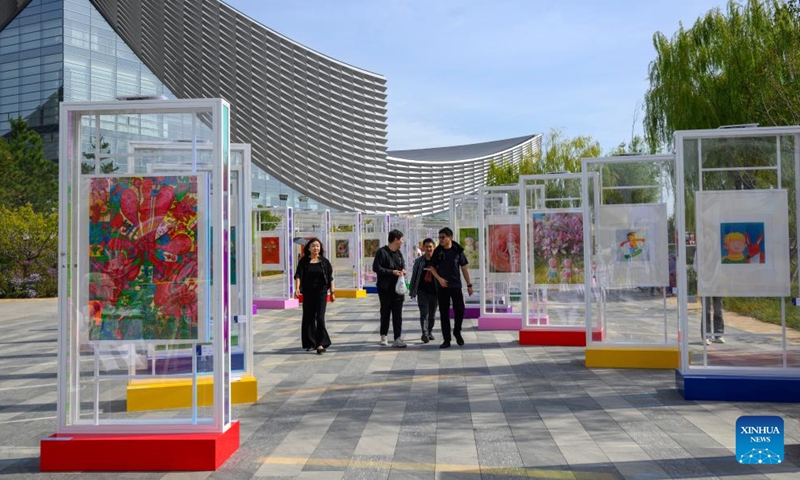 People visit an exhibition of the 2025 Grand Canal Public Art Season in Beijing, capital of China, Oct. 1, 2025. The 2025 Grand Canal Public Art Season kicked off here on Wednesday, enabling the public to experience the charm of art through interactive experiences. (Xinhua/Jin Liangkuai)