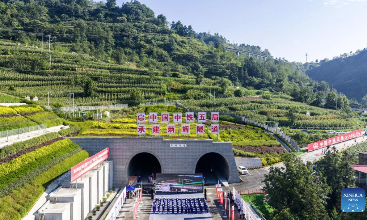 An aerial drone photo taken on Aug. 19, 2025 shows the construction site of Binghui tunnel in Yiliang county of Zhaotong, southwest China's Yunnan Province. As a key project of the Chongqing-Kunming high-speed railway, Binghui tunnel, with a total length of 21.17 kilometers, was successfully completed here on Tuesday.
Upon the full completion of the Chongqing-Kunming high-speed railway, travel time between Chongqing and Kunming will be significantly reduced, greatly enhancing transportation connectivity between the southwest region and the rest of the country, and promoting coordinated regional economic development. (Xinhua/Hu Chao)