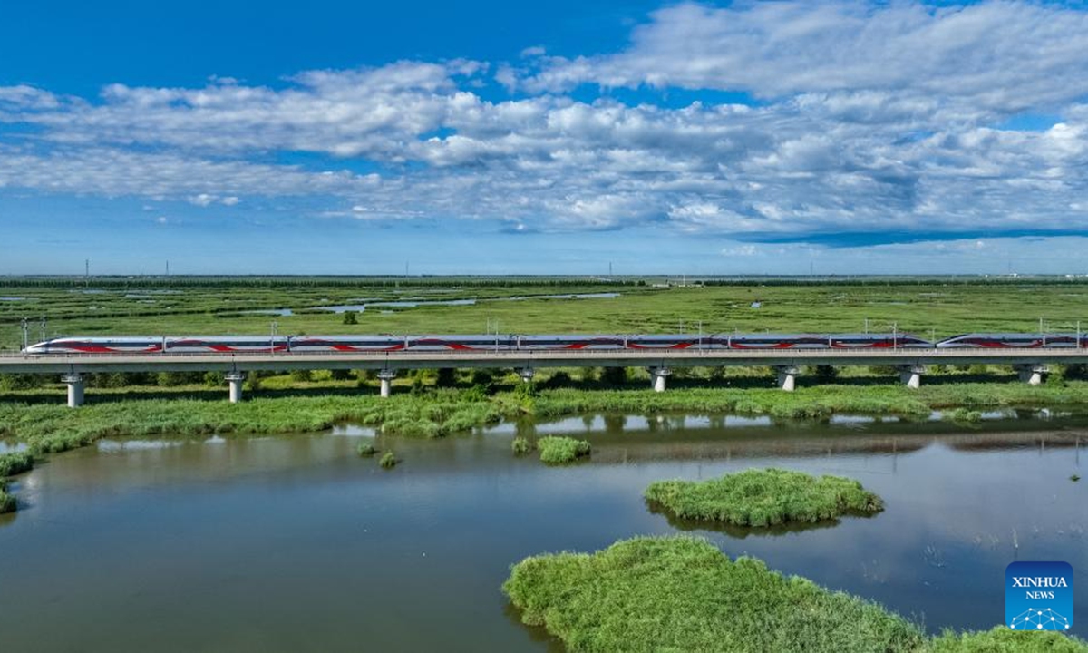 This drone photo taken on Aug. 17, 2025 shows a high-speed train running along the Harbin-Qiqihar railway. On Aug. 17, 2015, the Harbin-Qiqihar railway, Heilongjiang's first high-speed railway, from the provincial capital Harbin to Qiqihar City, was put into operation and became China's northernmost of its kind in operation in the northeastern province of China. (Photo by Yuan Yong/Xinhua)