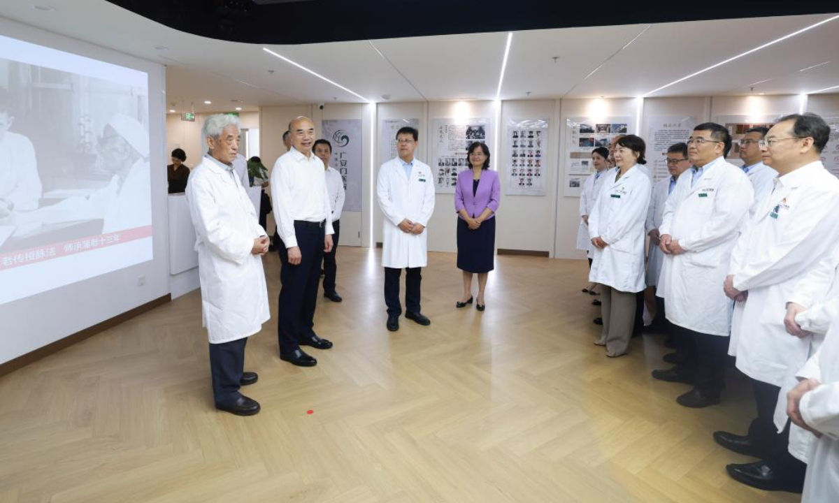 Chinese Vice Premier Liu Guozhong, also a member of the Political Bureau of the Communist Party of China Central Committee, visits medical workers at a traditional Chinese medicine (TCM) hospital in Beijing, capital of China, Aug. 19, 2025. Liu extended festival greetings on China's eighth Doctors' Day to all medical workers in China and credited them as vital contributors to the country's progress in public health. (Xinhua/Wang Ye)