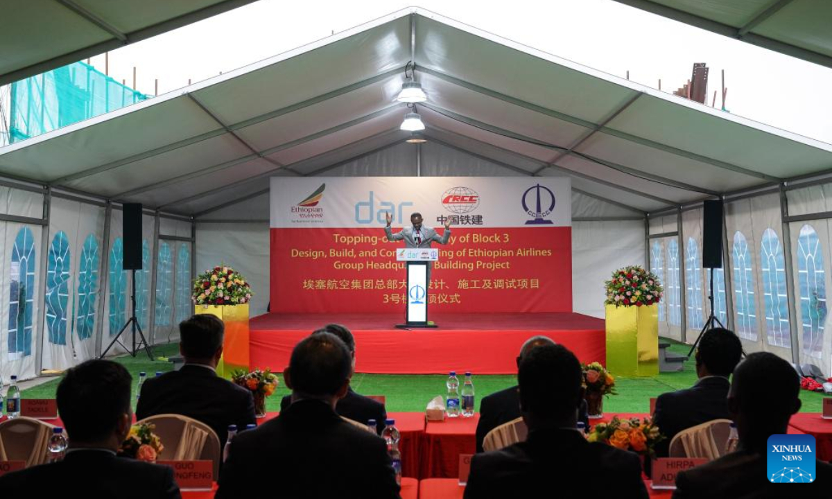 Photo taken on Aug. 18, 2025 shows a topping-out ceremony of the new Ethiopian Airlines Group headquarters building in Addis Ababa, Ethiopia. The new Ethiopian Airlines Group headquarters building, which is under construction in Addis Ababa, has topped out, marking completion of its main structural works. The topping-out ceremony of the 45-meter-high structure was held on Monday, attended by representatives from the Ethiopian Airlines Group and China Civil Engineering Construction Corporation (CCECC). (Xinhua/Han Xu)