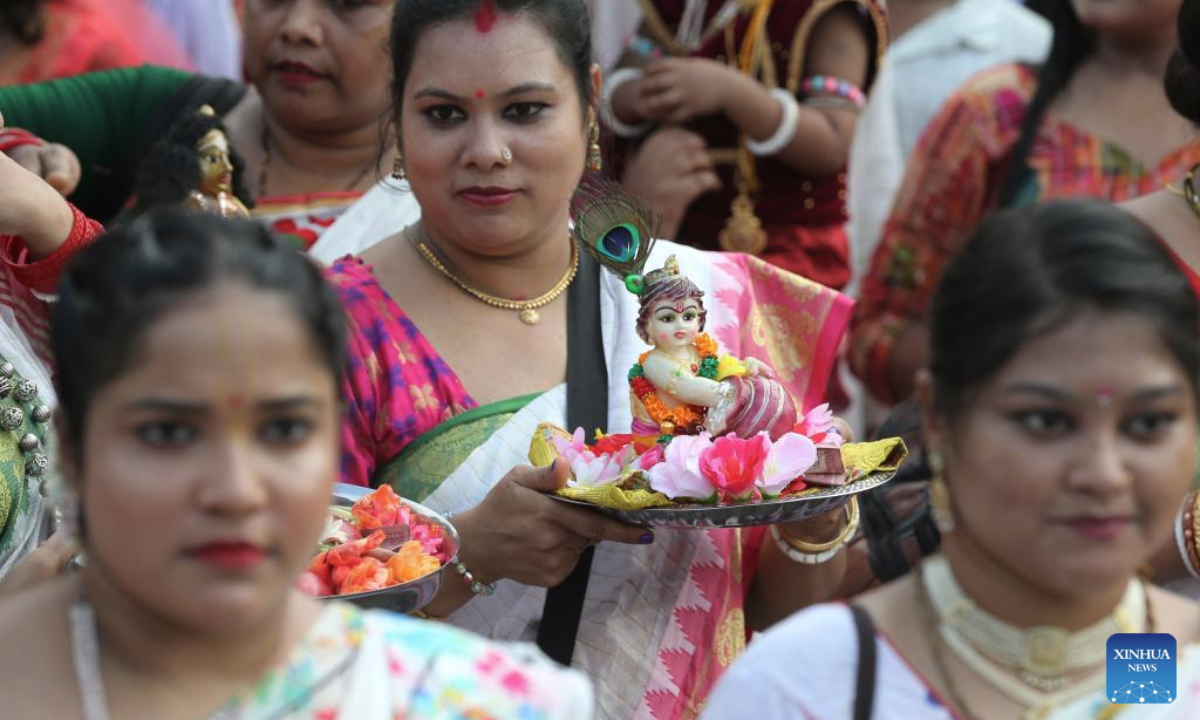 People celebrate the Krishna Janmashtami festival in Dhaka, Bangladesh, Aug. 16, 2025. The festival is celebrated annually to mark the birth anniversary of Hindu God Krishna. (Photo by Habibur Rahman/Xinhua)