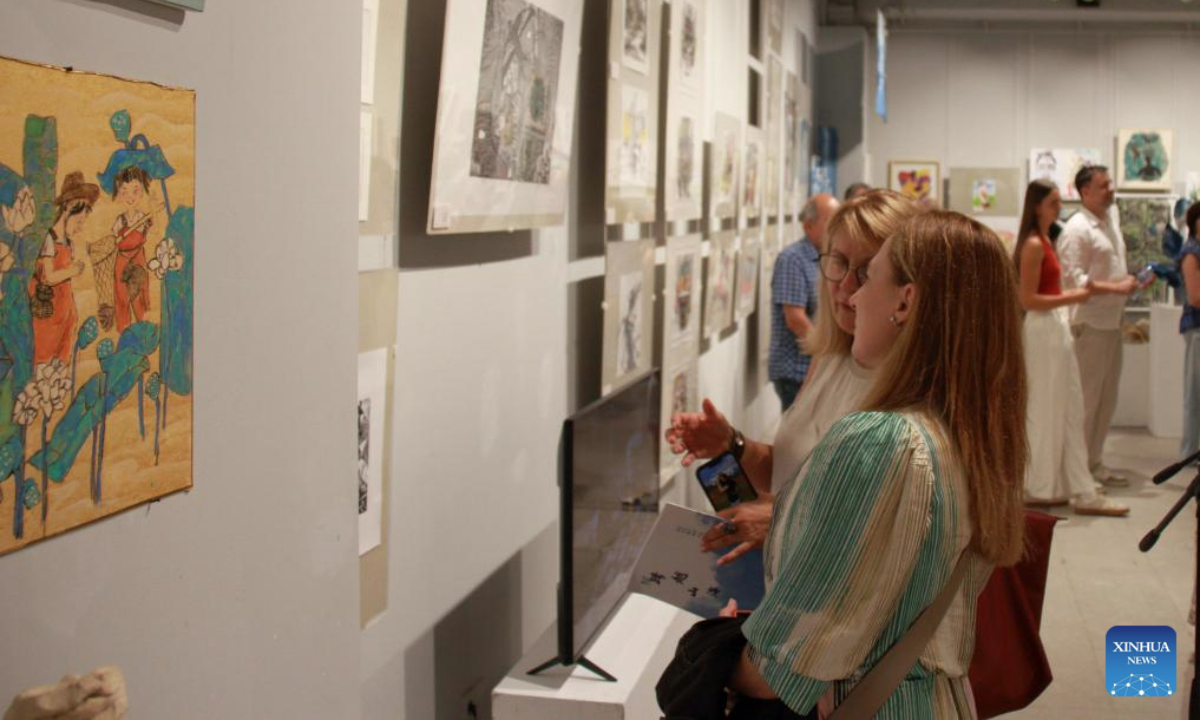 Visitors view artworks displayed at a China-Bulgaria art exhibition in Sofia, Bulgaria, Aug. 18, 2025. A joint exhibition featuring works by Chinese and Bulgarian artists opened here on Monday, highlighting cultural exchange and mutual understanding.

The six-day event presents more than 60 pieces, ranging from Chinese ink paintings, woodcarvings, embroidery, lacquer painting, tie-dye, batik, and digital art, to Bulgarian works inspired by traditional textiles, felt, and contemporary interpretations of local heritage. (Photo by Marian Draganov/Xinhua)