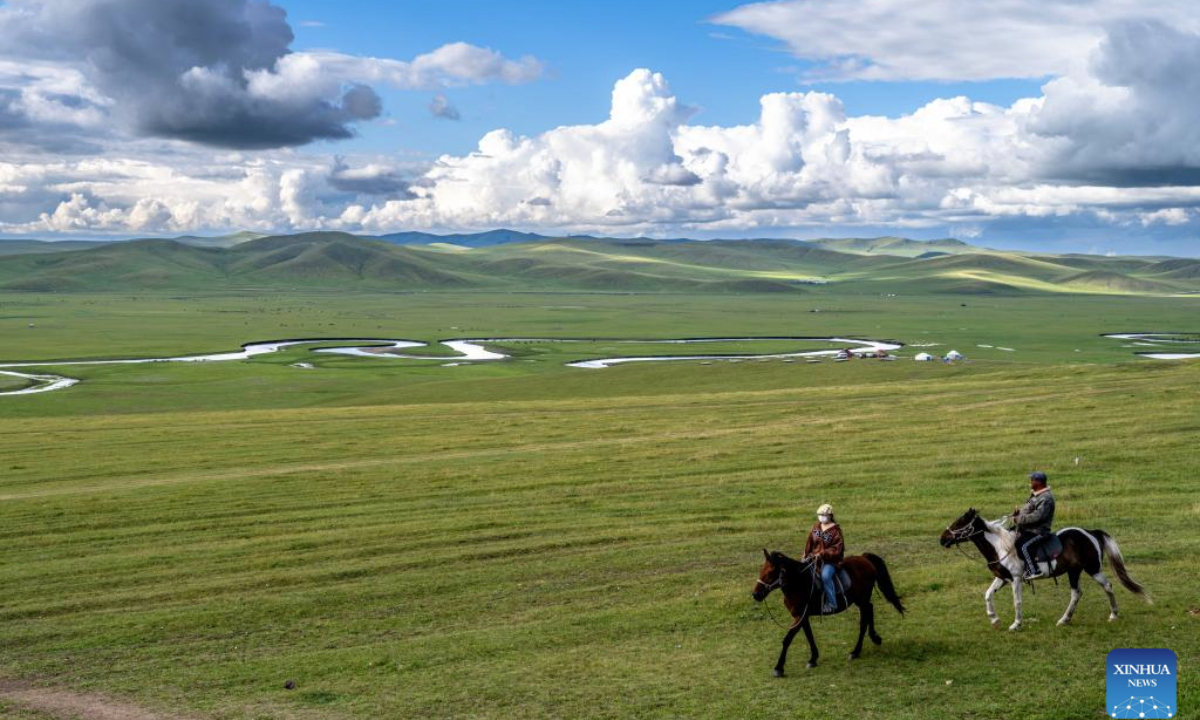 People ride horses near the Mergel Gol River in Hulun Buir, north China's Inner Mongolia Autonomous Region on Aug. 19, 2025. (Xinhua/Ma Jinrui)