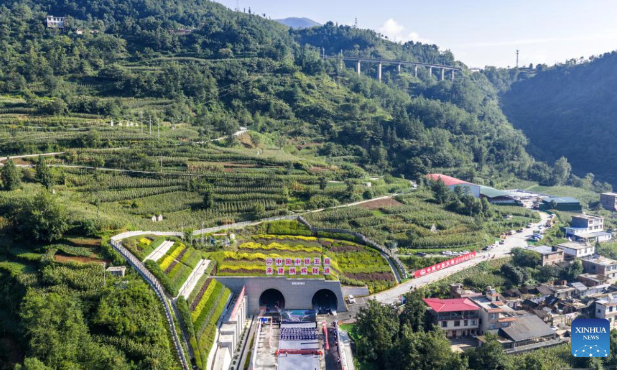 An aerial drone photo taken on Aug. 19, 2025 shows the construction site of Binghui tunnel in Yiliang county of Zhaotong, southwest China's Yunnan Province. As a key project of the Chongqing-Kunming high-speed railway, Binghui tunnel, with a total length of 21.17 kilometers, was successfully completed here on Tuesday.
Upon the full completion of the Chongqing-Kunming high-speed railway, travel time between Chongqing and Kunming will be significantly reduced, greatly enhancing transportation connectivity between the southwest region and the rest of the country, and promoting coordinated regional economic development. (Xinhua/Hu Chao)