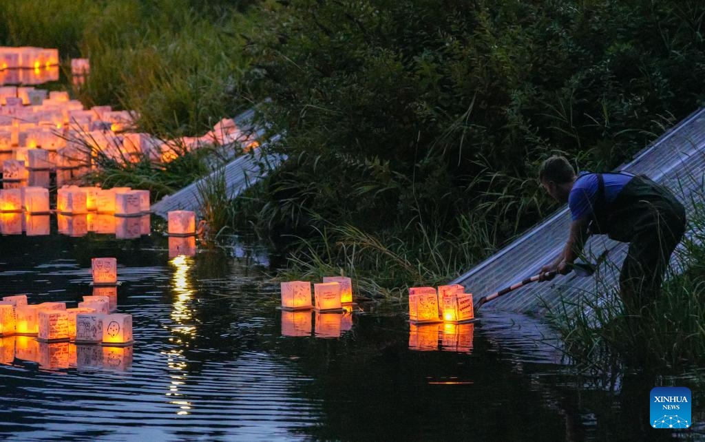 Lanterns float on water during the Water Lantern Festival at Lafarge Lake in Coquitlam, British Columbia, Canada, Aug. 16, 2025. The event attracted hundreds of residents and visitors to enjoy the illuminated lanterns and share wishes for hope and joy. (Photo by Liang Sen/Xinhua)