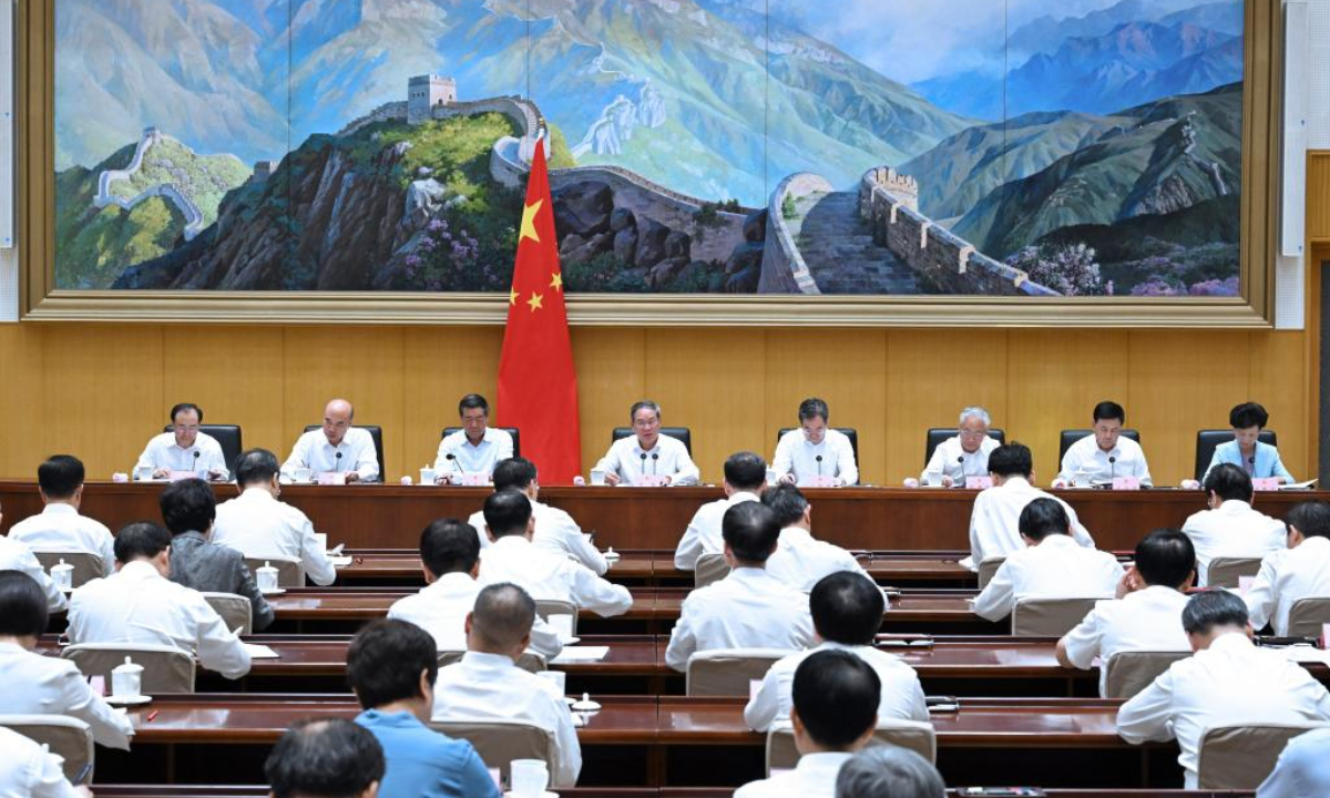 Chinese Premier Li Qiang chairs the ninth plenary meeting of the State Council on Aug. 18, 2025. Li stressed the importance of efforts to consolidate and expand the momentum of China's economic recovery and positive development trajectory, and of efforts to accomplish the country's annual economic and social development goals. (Xinhua/Rao Aimin)