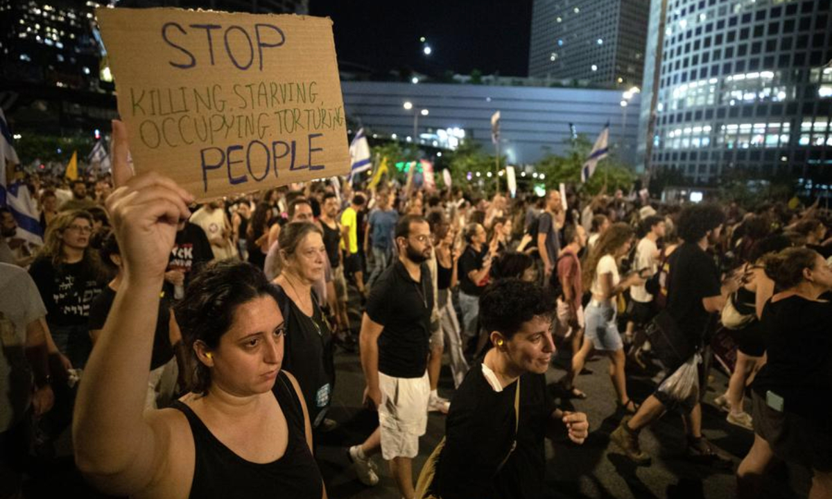 People take part in a rally in Tel Aviv, Israel, Aug. 17, 2025. (Xinhua/Chen Junqing)