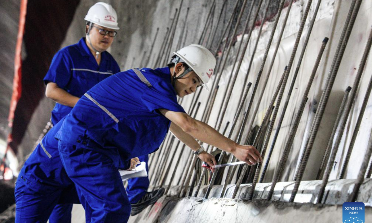 Workers work at the construction site of Binghui tunnel in Yiliang county of Zhaotong, southwest China's Yunnan Province, Aug. 19, 2025. As a key project of the Chongqing-Kunming high-speed railway, Binghui tunnel, with a total length of 21.17 kilometers, was successfully completed here on Tuesday.
Upon the full completion of the Chongqing-Kunming high-speed railway, travel time between Chongqing and Kunming will be significantly reduced, greatly enhancing transportation connectivity between the southwest region and the rest of the country, and promoting coordinated regional economic development. (Xinhua/Hu Chao)