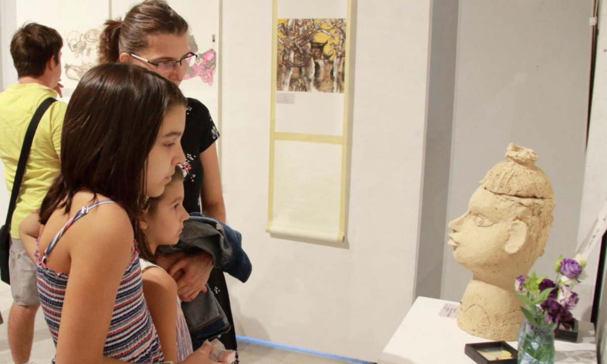 Visitors view an artwork displayed at a China-Bulgaria art exhibition in Sofia, Bulgaria, Aug. 18, 2025. A joint exhibition featuring works by Chinese and Bulgarian artists opened here on Monday, highlighting cultural exchange and mutual understanding.

The six-day event presents more than 60 pieces, ranging from Chinese ink paintings, woodcarvings, embroidery, lacquer painting, tie-dye, batik, and digital art, to Bulgarian works inspired by traditional textiles, felt, and contemporary interpretations of local heritage. (Photo by Marian Draganov/Xinhua)