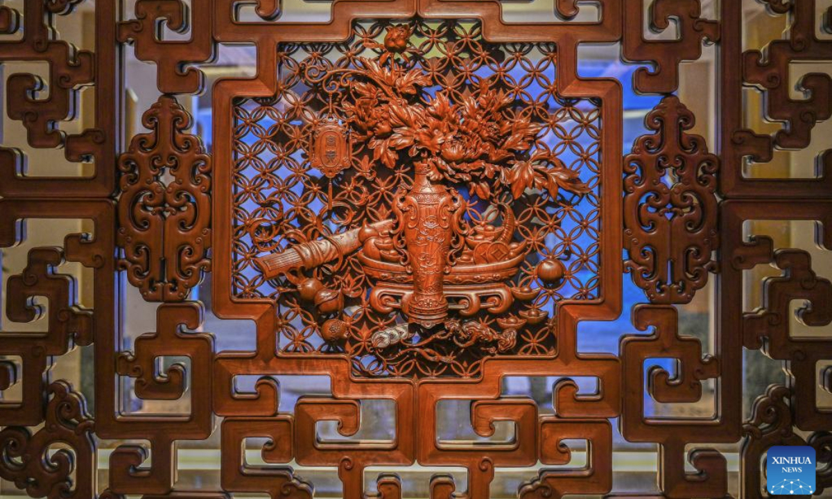 This photo taken on Aug. 18, 2025 shows a piece of wooden handicraft at Fujian Sanfu Classical Furniture Co., Ltd. in Xianyou County, Putian City, southeast China's Fujian Province. In recent years, Xianyou County has promoted the upgrading and transformation of traditional art and crafts industry, establishing four major product categories which include high-end collections, fine home decoration, new Chinese-style light luxury, and cultural and creative small items. It has also accelerated its overseas market layout through e-commerce live-streaming. (Xinhua/Zhou Yi)