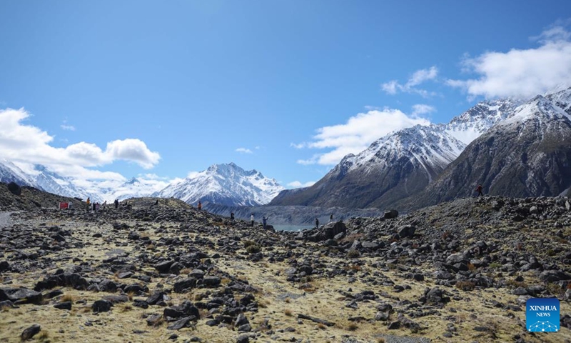 People visit Aoraki/Mount Cook National Park in the South Island of New Zealand, Oct. 1, 2025. Integrating a variety of landscapes including snowy mountains, glaciers, and lakes, the Aoraki/Mount Cook National Park draws numerous tourists to visit with its spectacular scenery. (Xinhua/Long Lei)
