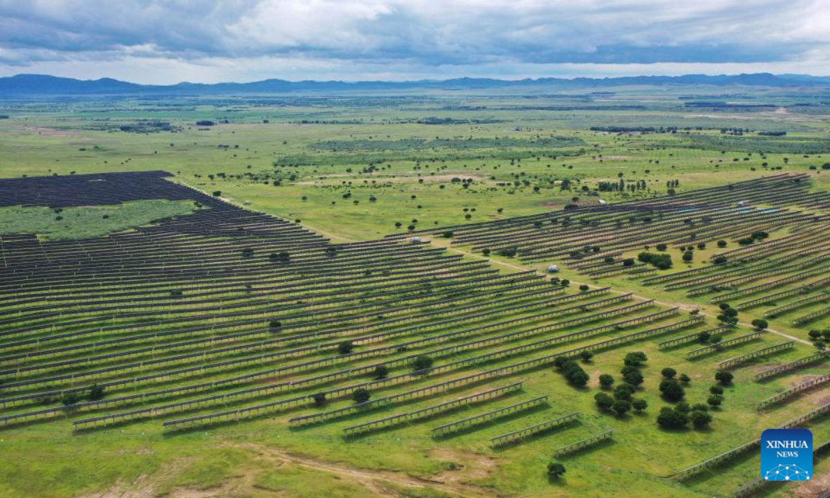 An aerial drone photo taken on July 29, 2025 shows photovoltaic panels at the site of a desertification control project integrated with wind and solar power facilities in Horqin Right Wing Middle Banner of Hinggan League, north China's Inner Mongolia Autonomous Region. In recent years, Inner Mongolia has focused on the desertification control of the Horqin sandy land. The local authorities implemented projects integrating sand control and wind and solar power industries, establishing renewable energy facilities alongside afforestation and soil improvement efforts. (Xinhua/Ding He)