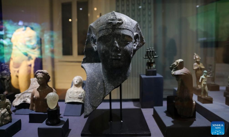 This photo taken on Aug. 20, 2025 shows artifacts during an exhibition of sunken antiquities recovered from the Mediterranean Sea at Alexandria National Museum in Alexandria, Egypt. Egypt opened on Wednesday an exhibition of sunken antiquities at the Alexandria National Museum, showcasing treasures from the Mediterranean seabed. Dubbed the Secrets of the Sunken City Exhibition, the exhibition showcased 86 rare artifacts recovered from several sites in Alexandria, including the two submerged cities of Thonis-Heracleion and Canopus, and the submerged Royal Quarter in the Eastern Harbor of ancient Alexandria. (Xinhua/Sui Xiankai)