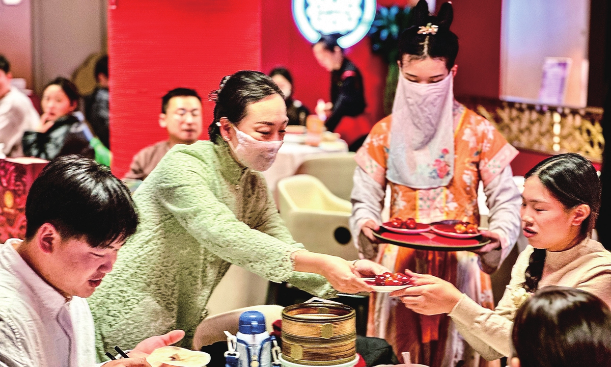 People dine at the Quanjude restaurant in Wangfujing, Beijing, in February 2025.