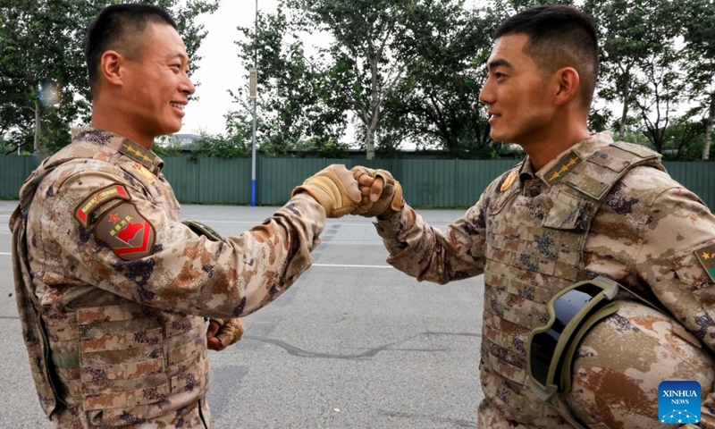 Participants who will take part in the upcoming V-Day military parade encourage each other in Beijing, capital of China, Aug. 12, 2025. Participants are busy preparing for the upcoming V-Day military parade scheduled on Sept. 3 in Tian'anmen Square to mark the 80th anniversary of the victory in the Chinese People's War of Resistance Against Japanese Aggression and the World Anti-Fascist War. (Photo: Xinhua)