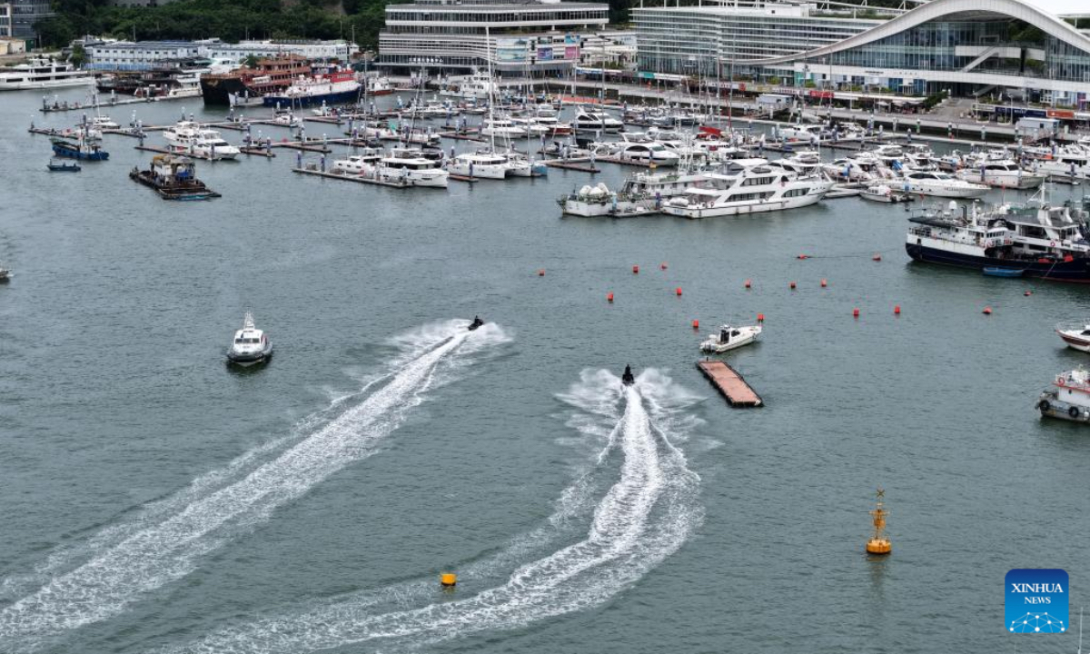 An aerial photo taken on Aug 23, 2025 shows yachts returning to a dock in Sanya, south China's Hainan Province. China on Saturday activated a Level-IV emergency response to flooding and typhoon in Hainan Province as Typhoon Kajiki, the 13th typhoon of this year, is approaching, according to the Ministry of Emergency Management. (Xinhua/Zhao Yingquan)