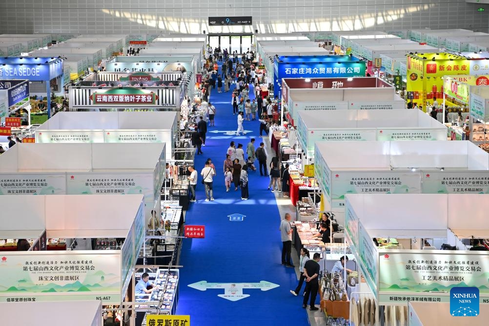 People visit the 7th Shanxi Cultural Industries Fair in Taiyuan, north China's Shanxi Province, Aug. 21, 2025. The fair kicked off here on Thursday and will last till Aug. 25, attracting about 2,000 exhibitors from over 30 countries and regions worldwide. Photo: Xinhua