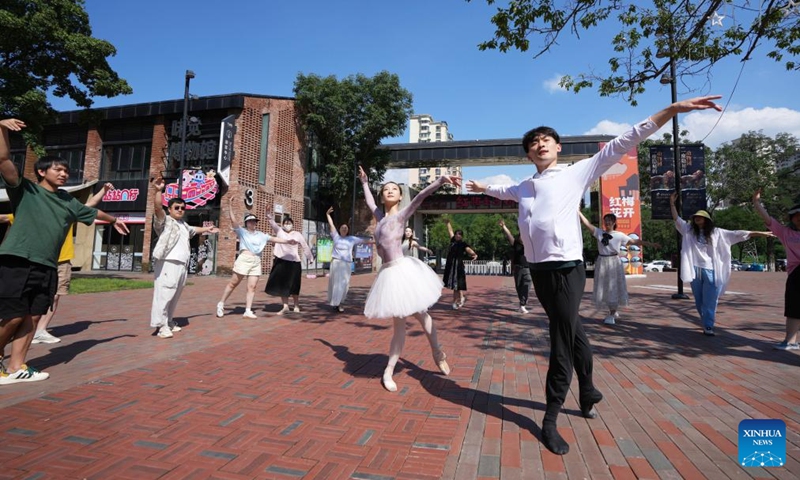 Residents and tourists, led by dancers from the Liaoning Ballet Troupe, try ballet dancing at a cultural and creative park in Shenyang, northeast China's Liaoning Province, July 30, 2025.

The Liaoning (Shenyang) Ballet Competition was held in Shenyang from Aug. 8 to 14, attracting more than 400 contestants from over 10 countries and regions.

Established in Shenyang in 1980, the Liaoning Ballet Troupe has been thriving along with this industrial hub for more than four decades. A school affiliated to the Troupe was launched in 1994, which has been training dancers from all over the world since then. Photo: Xinhua