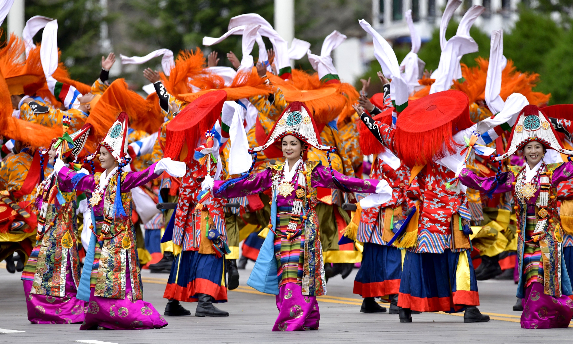 People take part in a grand mass parade during the 60th anniversary celebration of the founding of Southwest China's Xizang Autonomous Region at the Potala Palace Square in Lhasa on August 21, 2025.