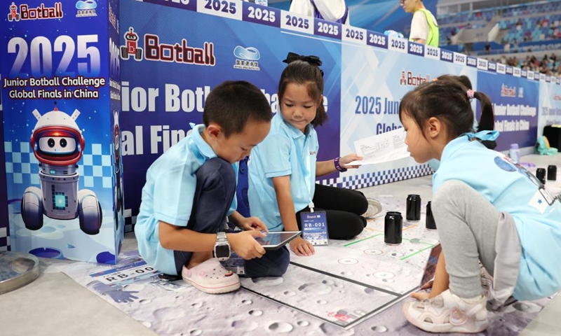 Participants compete during the 2025 Junior Botball Challenge Global Finals in China in Beijing, capital of China, Aug. 21, 2025. The 2025 Junior Botball Challenge Global Finals in China kicked off on Thursday at the National Speed Skating Oval in Beijing. Nearly 1,500 young science and technology enthusiasts from more than ten countries and regions, including China, the United States, Malaysia, Thailand, Austria, and Slovakia, participated in the event. Photo: Xinhua