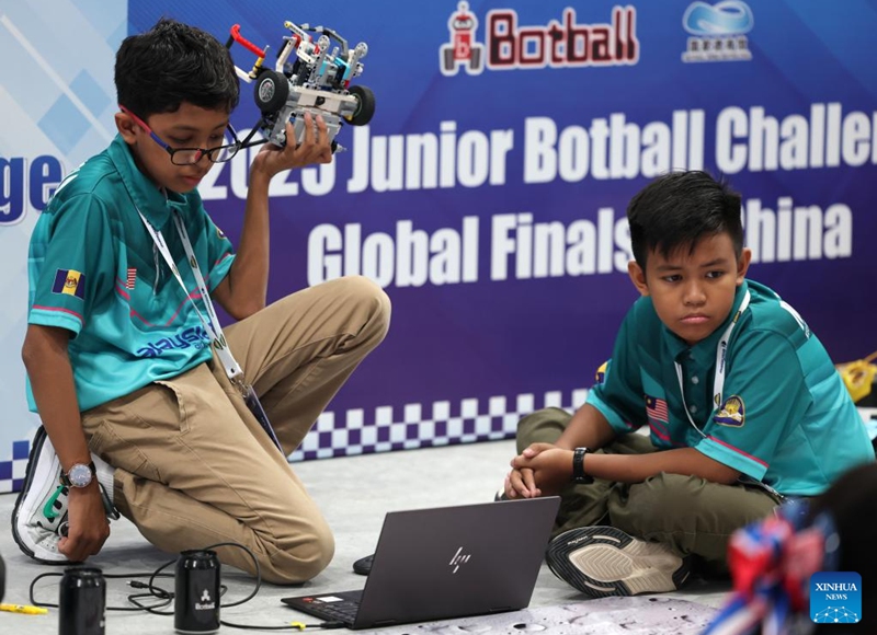 Participants from Malaysia compete during the 2025 Junior Botball Challenge Global Finals in China in Beijing, capital of China, Aug. 21, 2025. The 2025 Junior Botball Challenge Global Finals in China kicked off on Thursday at the National Speed Skating Oval in Beijing. Nearly 1,500 young science and technology enthusiasts from more than ten countries and regions, including China, the United States, Malaysia, Thailand, Austria, and Slovakia, participated in the event. Photo: Xinhua