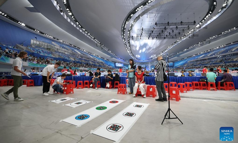 Participants from Austria (L) compete during the 2025 Junior Botball Challenge Global Finals in China in Beijing, capital of China, Aug. 21, 2025. The 2025 Junior Botball Challenge Global Finals in China kicked off on Thursday at the National Speed Skating Oval in Beijing. Nearly 1,500 young science and technology enthusiasts from more than ten countries and regions, including China, the United States, Malaysia, Thailand, Austria, and Slovakia, participated in the event. Photo: Xinhua