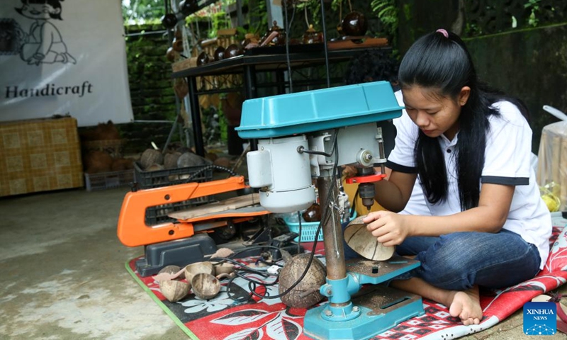 A girl works at a handicraft workshop in Yangon, Myanmar, Aug. 19, 2025. (Xinhua/Myo Kyaw Soe)
