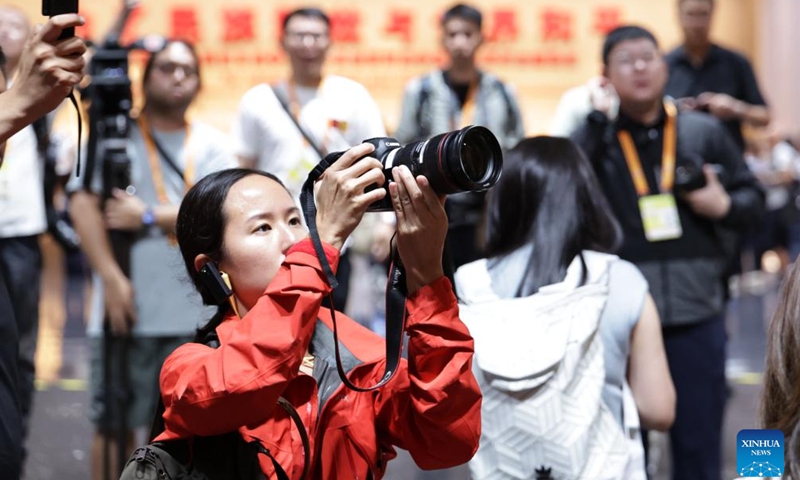 A journalist takes pictures during the visit to the Museum of the War of Chinese People's Resistance Against Japanese Aggression in Beijing, capital of China, Aug. 27, 2025. Nearly 200 journalists went to the Museum of the War of Chinese People's Resistance Against Japanese Aggression for visits and interviews on Wednesday.