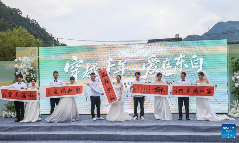 Couples participate in a group wedding ceremony during a folk culture activity in Dongbaihu Town of Zhuji City, east China's Zhejiang Province, Aug. 20, 2025. A series of folk culture and tourism activities were held here in celebration of the upcoming traditional Qixi Festival, known as Chinese Valentine's Day. Photo: Xinhua
