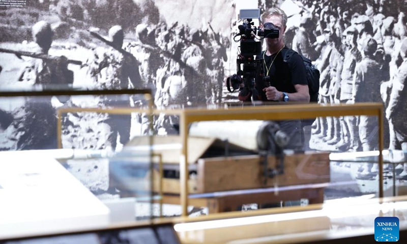 A journalist shoots videos during the visit to the Museum of the War of Chinese People's Resistance Against Japanese Aggression in Beijing, capital of China, Aug. 27, 2025. Nearly 200 journalists went to the Museum of the War of Chinese People's Resistance Against Japanese Aggression for visits and interviews on Wednesday.
