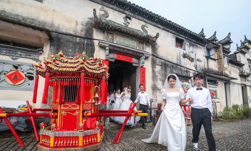Couples participate in a group wedding ceremony during a folk culture activity in Dongbaihu Town of Zhuji City, east China's Zhejiang Province, Aug. 20, 2025. A series of folk culture and tourism activities were held here in celebration of the upcoming traditional Qixi Festival, known as Chinese Valentine's Day. Photo: Xinhua