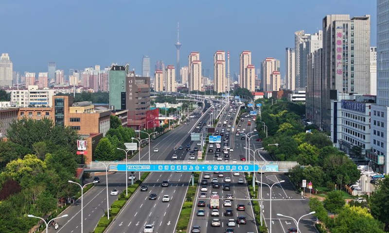 An aerial drone photo shows a pedestrian overpass adorned with a banner of the Shanghai Cooperation Organization (SCO) Summit 2025 in Xiqing District, north China's Tianjin, Aug. 5, 2025. Photo: Xinhua