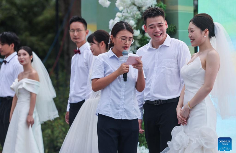 Couples participate in a group wedding ceremony during a folk culture activity in Dongbaihu Town of Zhuji City, east China's Zhejiang Province, Aug. 20, 2025. A series of folk culture and tourism activities were held here in celebration of the upcoming traditional Qixi Festival, known as Chinese Valentine's Day. Photo: Xinhua