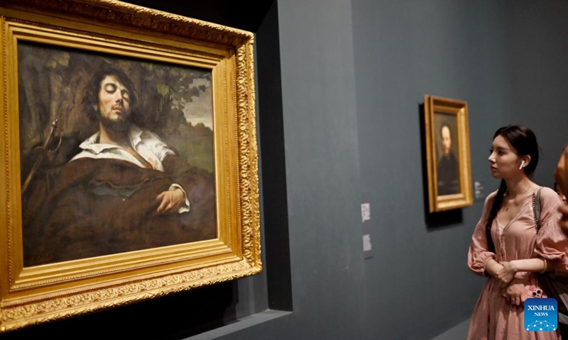 A visitor observes a masterpiece of Gustave Courbet during the exhibition of Paths to Modernity: Masterpieces from the Musee d'Orsay, Paris at the Museum of Art Pudong in east China's Shanghai, Aug. 20, 2025. Opened here on June 19, the exhibition gathers over 100 masterpieces from the 1840s to the early 20th century, encompassing nearly all major artistic movements represented in the Musee d'Orsay's collections. Photo: Xinhua