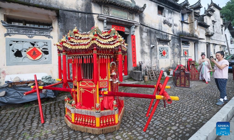 A bridal sedan chair is pictured during a folk culture activity in Dongbaihu Town of Zhuji City, east China's Zhejiang Province, Aug. 20, 2025. A series of folk culture and tourism activities were held here in celebration of the upcoming traditional Qixi Festival, known as Chinese Valentine's Day. Photo: Xinhua