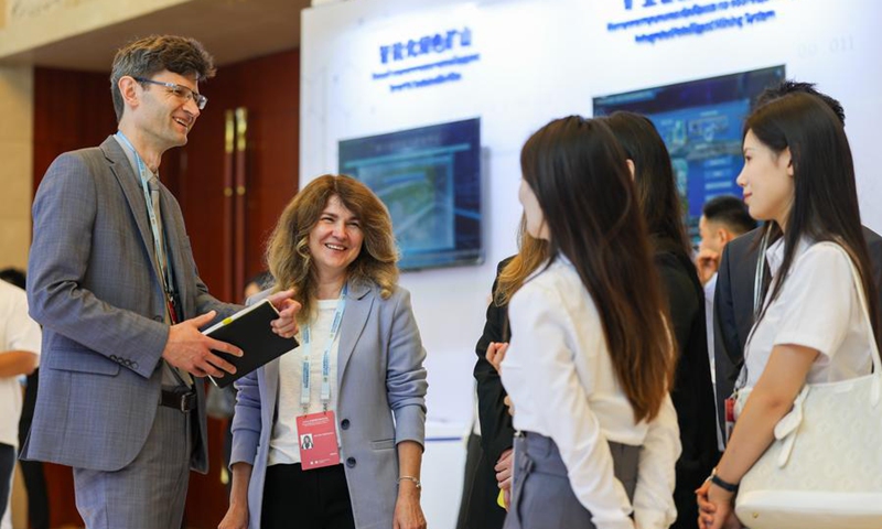 Guests and exhibitors communicate at the interactive experience zone during the 2025 Shanghai Cooperation Organization (SCO) Digital Economy Forum in north China's Tianjin, July 11, 2025. Photo: Xinhua