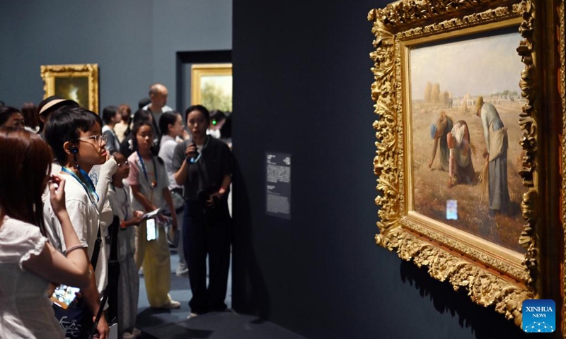 Visitors observe a masterpiece of Jean-Francois Millet during the exhibition of Paths to Modernity: Masterpieces from the Musee d'Orsay, Paris at the Museum of Art Pudong in east China's Shanghai, Aug. 20, 2025. Opened here on June 19, the exhibition gathers over 100 masterpieces from the 1840s to the early 20th century, encompassing nearly all major artistic movements represented in the Musee d'Orsay's collections. Photo: Xinhua