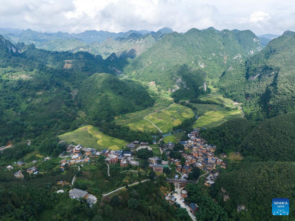 An aerial drone photo taken on Aug. 25, 2025 shows a view of the Bamei Village in Guangnan County, Wenshan Zhuang and Miao Autonomous Prefecture, southwest China's Yunnan Province. In recent years, Bamei Village has developed local tourism utilizing its karst landscapes and cultural resources. A tourist resort which helps boost the local service sector has taken shape. (Xinhua/Gao Yongwei)