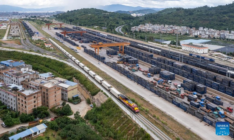 An aerial drone photo taken on Aug. 23, 2025 shows an international freight train bound for Lao capital Vientiane departing from Yanhe Station of China-Laos Railway in Yuxi City, southwest China's Yunnan Province. (Xinhua/Chen Xinbo)
