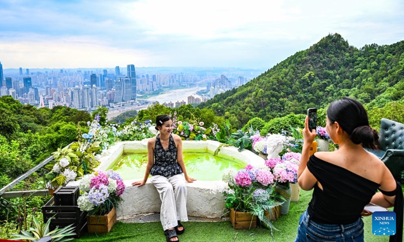 Tourists take photos at the Nanshan scenic spot in southwest China's Chongqing Municipality, Aug. 23, 2025. (Xinhua/Wang Quanchao)
