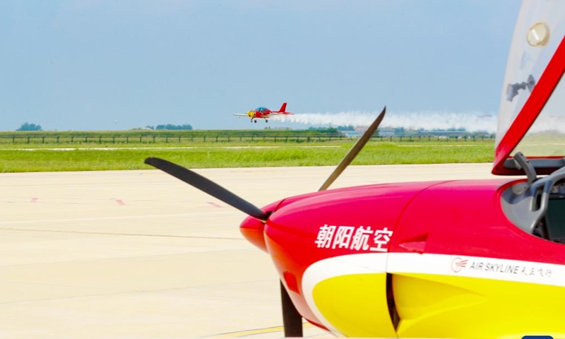 Enthusiasts fly a light-sport aircraft at a general aviation industrial park in Laixi, Qingdao, east China's Shandong Province, Aug. 24, 2025. Laixi City has made efforts in promoting general aviation industry, including establishing a professional industrial park, introducing airplane manufacture companies and developing flight training business, which have activated the vitality of low-altitude economy. (Photo: Xinhua)