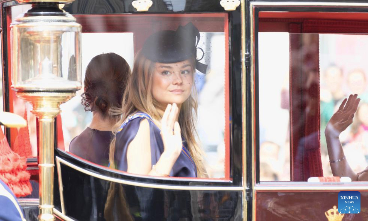 Dutch Princess Ariane waves to people in the Glass Coach on Prinsjesdag, or Prince's Day, in The Hague, the Netherlands, Sept. 16, 2025. The third Tuesday of September is the Prince's Day in the Netherlands, which marks the opening of the Dutch parliamentary season, and on this day the reigning monarch outlines the government's plans for the year ahead. (Photo by Sylvia Lederer/Xinhua)
