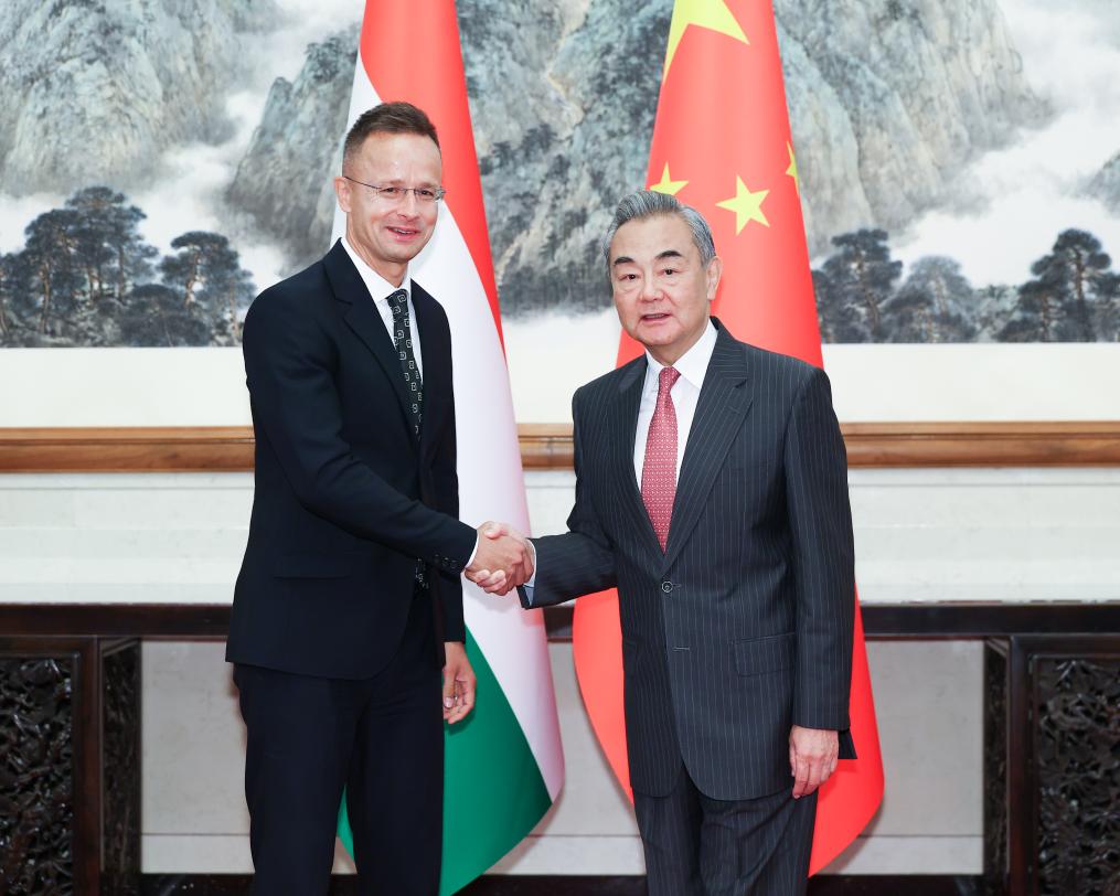 Chinese Foreign Minister Wang Yi, also a member of the Political Bureau of the Communist Party of China Central Committee, meets with Hungarian Minister of Foreign Affairs and Trade Peter Szijjarto, who is in China to attend commemorations marking the 80th anniversary of the victory in the Chinese People's War of Resistance against Japanese Aggression and the World Anti-Fascist War, in Beijing, capital of China, Sept. 3, 2025. (Xinhua/Liu Bin)