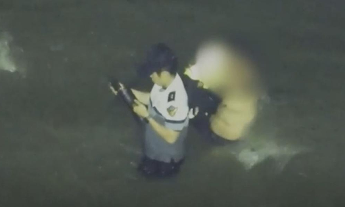 A screenshot from a video released by South Korean media outlet Chosun Daily shows Officer Lee Jae-seok rescuing a Chinese national