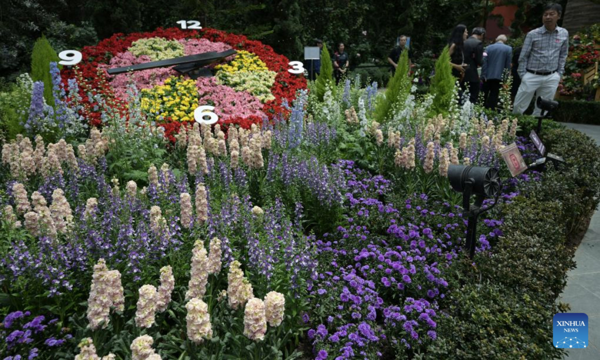People visit an alpine adventure themed floral display at the Singapore's Gardens by the Bay on Sept. 8, 2025. (Photo by Then Chih Wey/Xinhua)